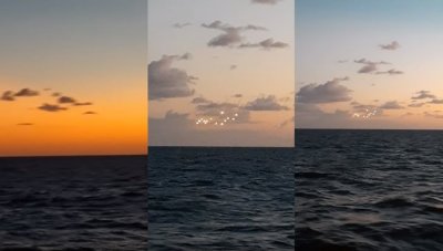 ​UFO？美国北卡罗莱纳州外海黄昏海面天空出现14个奇异光点